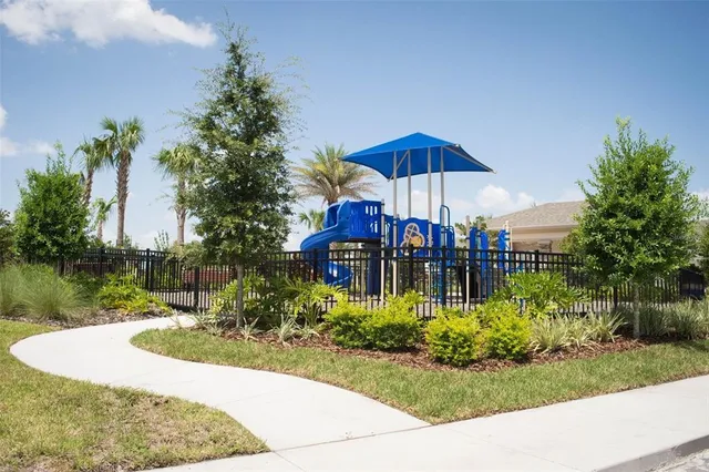a view of a swimming pool with a table and chairs