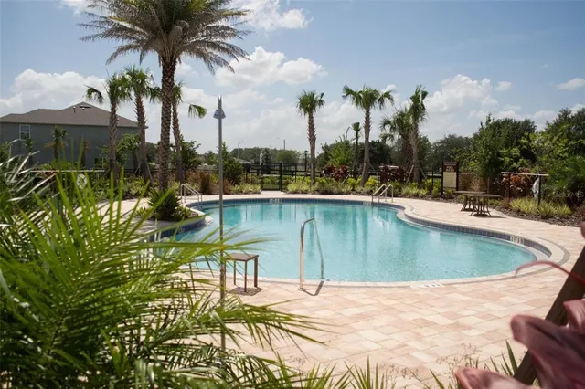 a side view of a building with a yard