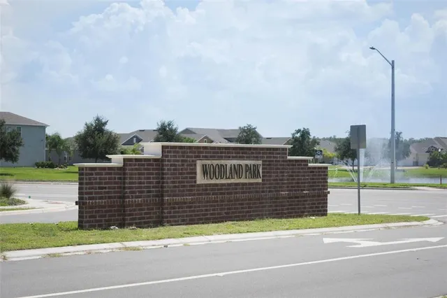 a view of a terrace with furniture and a yard