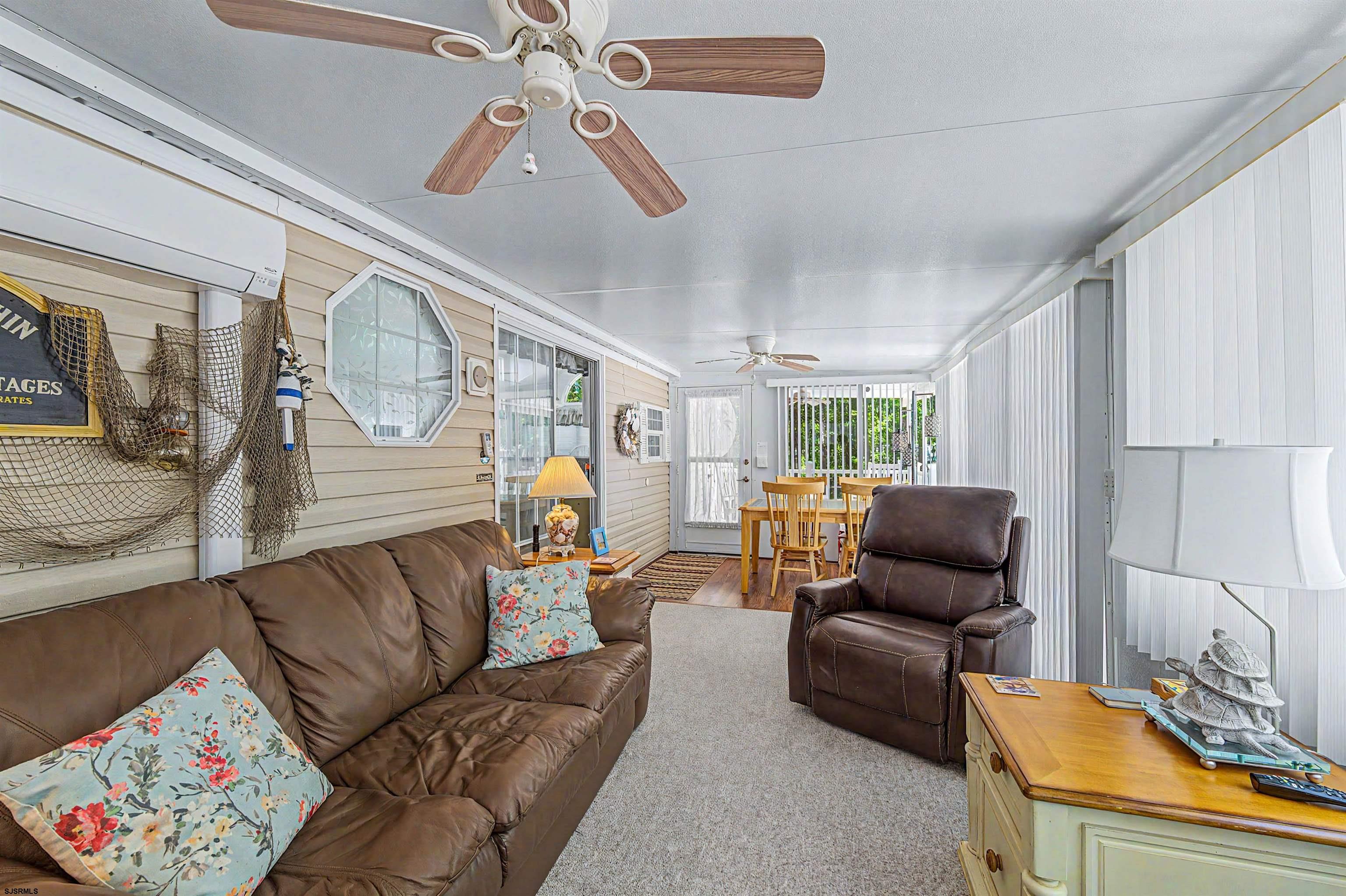 3066 Route 9 Ocean View, NJ 08230 - Photo 10 of 29 a living room with furniture and a chandelier