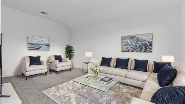 a living room with furniture or couch and a couch