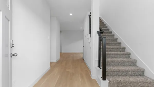a view of a hallway with staircase