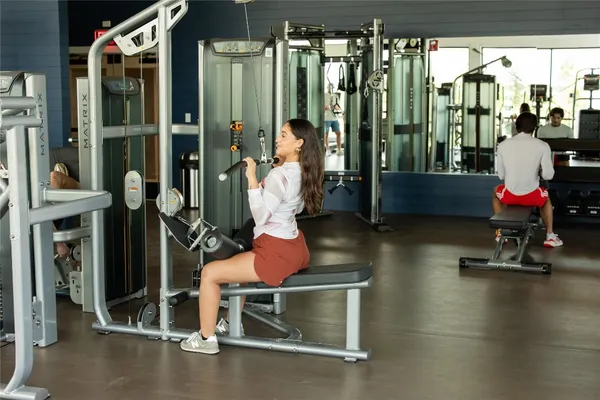 a room with gym equipment and large window