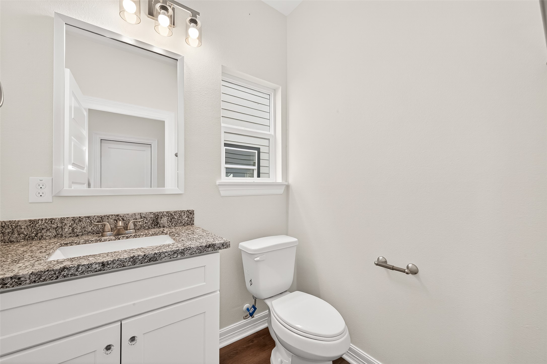 422 North 4th Street Beasley, TX 77417 - Photo 13 of 25 a bathroom with a granite countertop sink vanity mirror and toilet