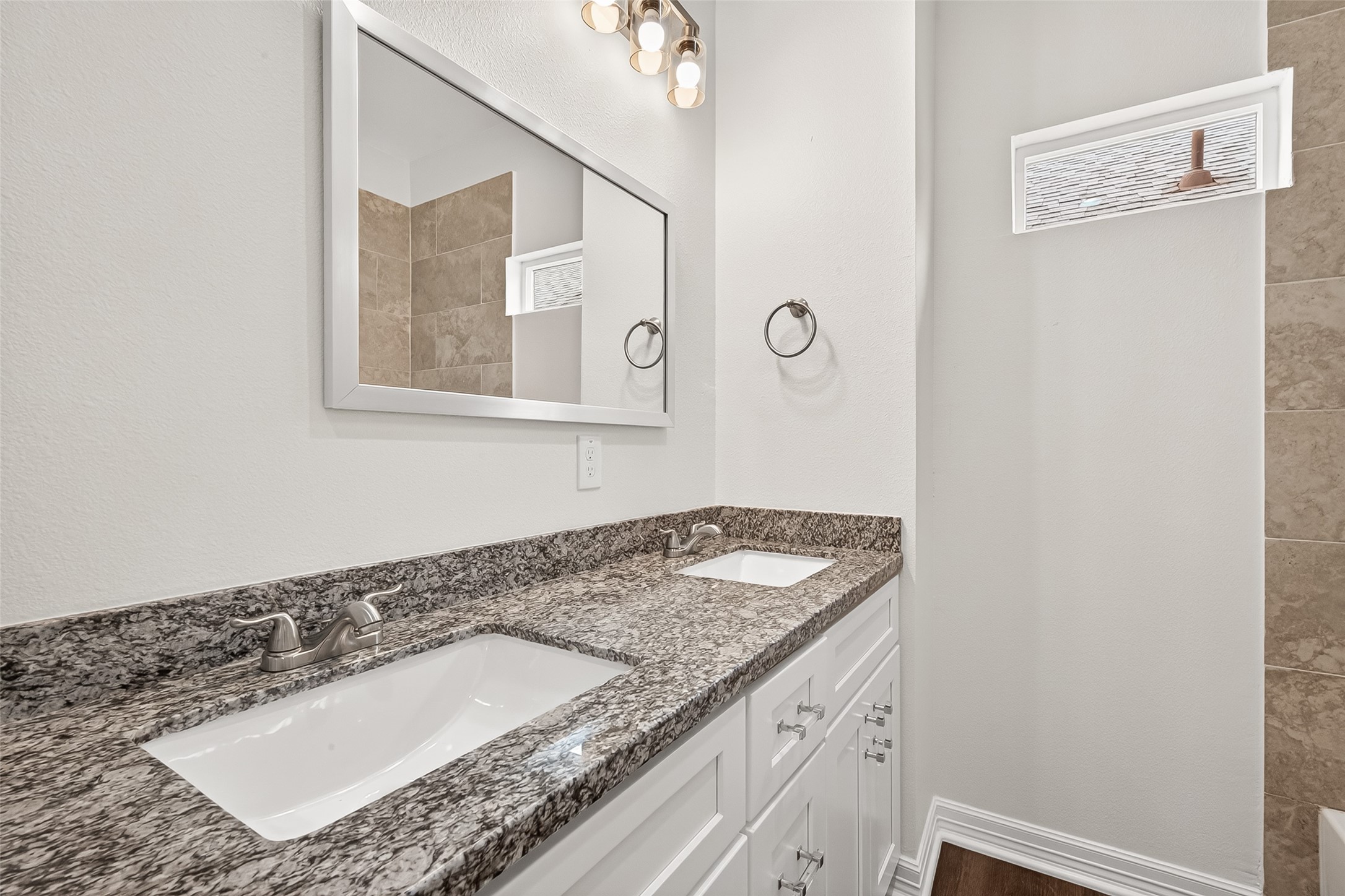 422 North 4th Street Beasley, TX 77417 - Photo 15 of 25 a bathroom with a granite countertop sink and a mirror