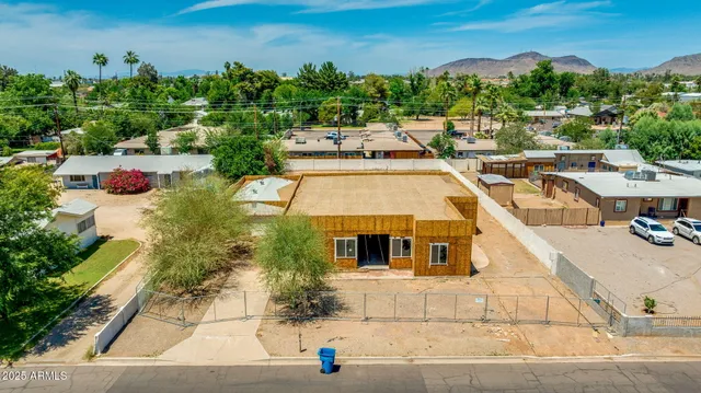 a aerial view of a house with a yard