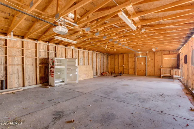 a view of an empty room with a garage