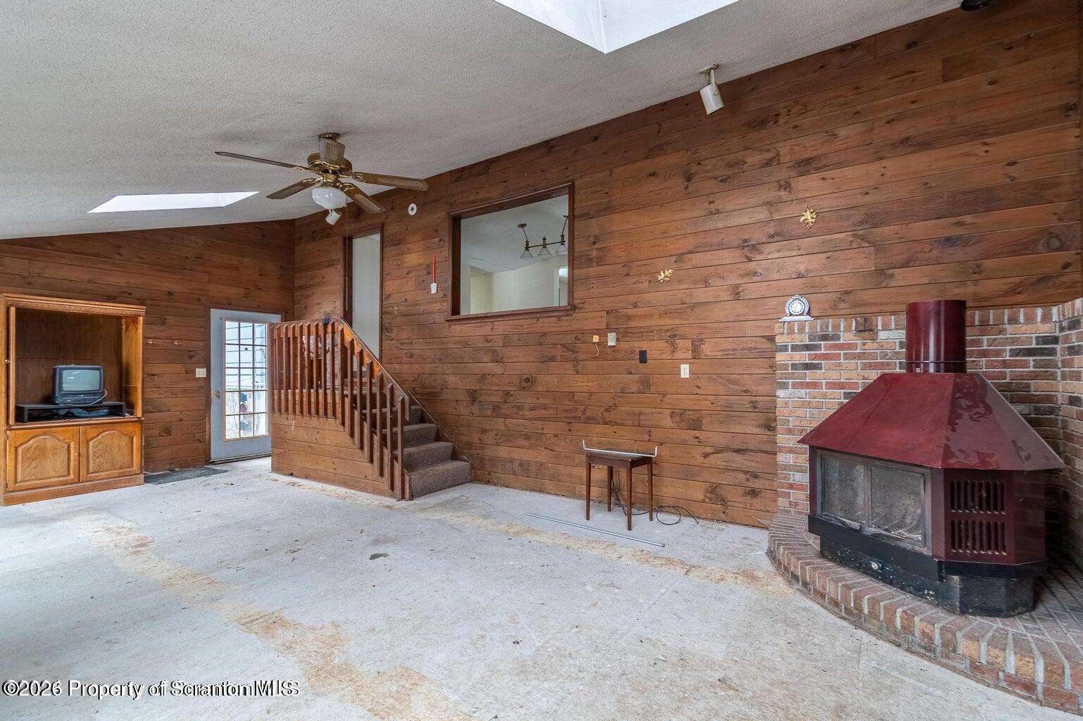 1777 Lamb Road Thompson, PA 18465 - Photo 6 of 31 a view of a livingroom with furniture and a fireplace