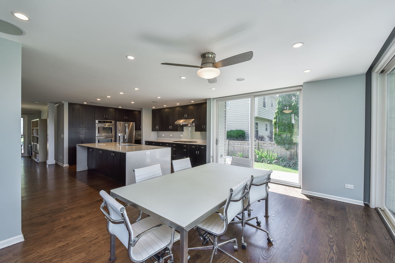 1325 Culpepper Drive Naperville, IL 60540 - Photo 11 of 34 a view of a dining room with furniture window and wooden floor