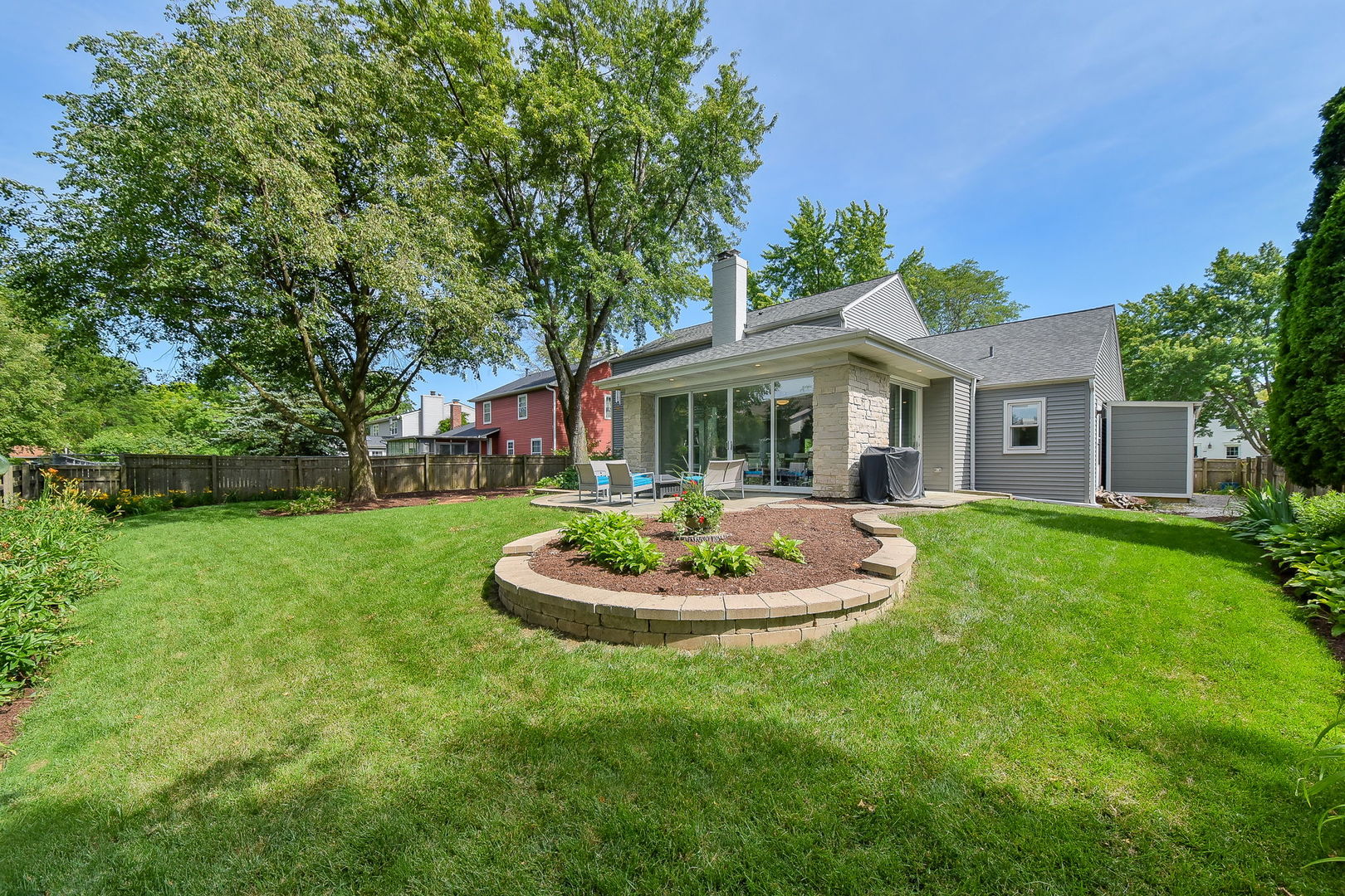 1325 Culpepper Drive Naperville, IL 60540 - Photo 31 of 34 a big house with a big yard and potted plants
