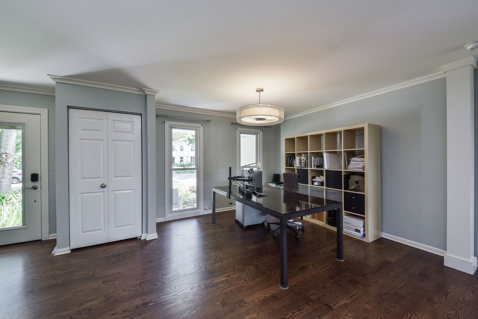 1325 Culpepper Drive Naperville, IL 60540 - Photo 4 of 34 an empty room with wooden floor lounge chair and windows
