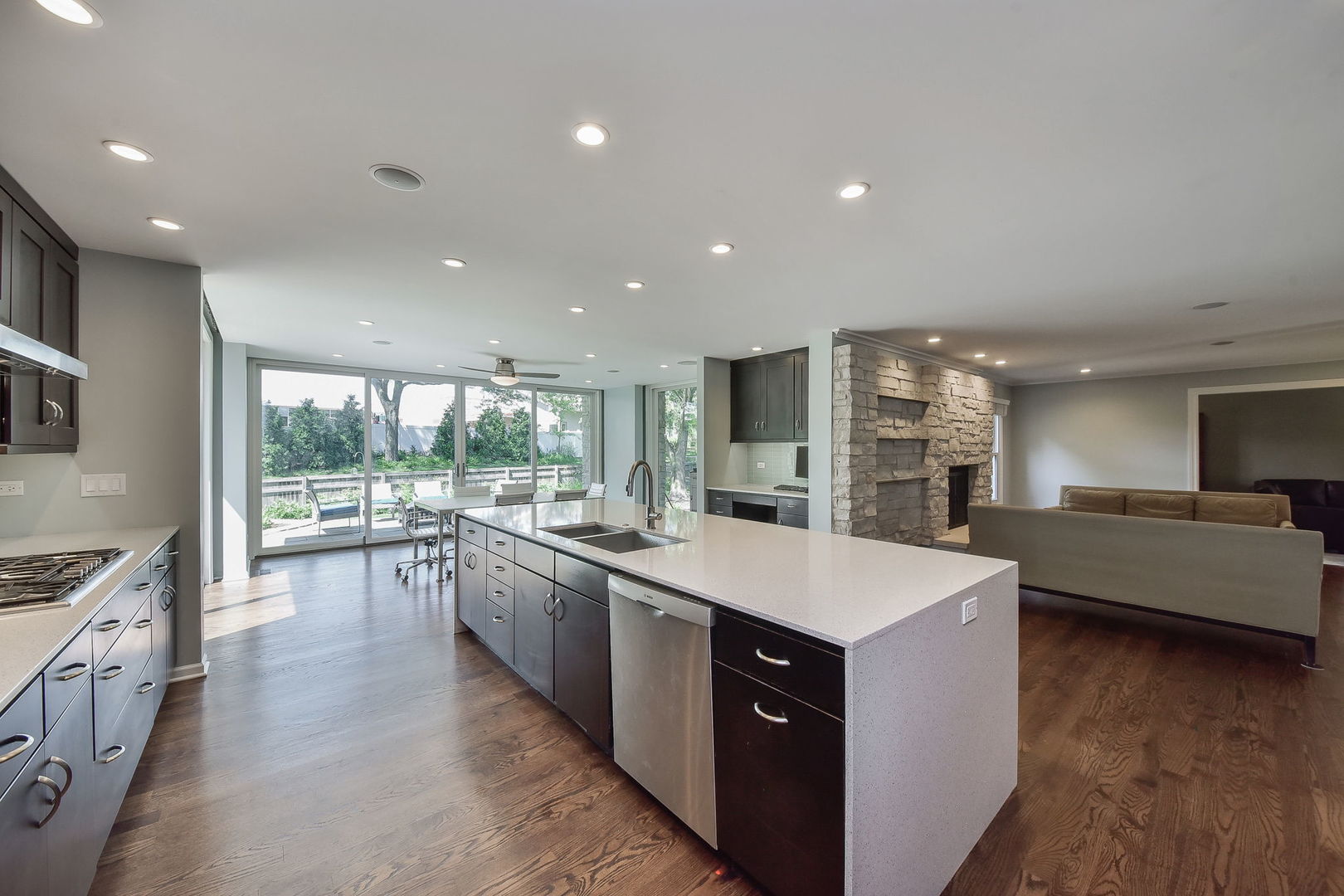 1325 Culpepper Drive Naperville, IL 60540 - Photo 8 of 34 a large kitchen with stainless steel appliances a lot of counter space and a wooden floors