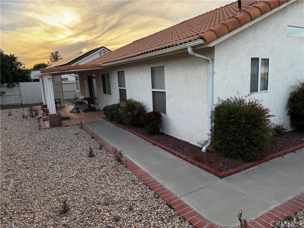 27519 Terrytown Road Menifee, CA 92586 - Photo 6 of 22 a backyard of a house with yard barbeque oven and outdoor seating