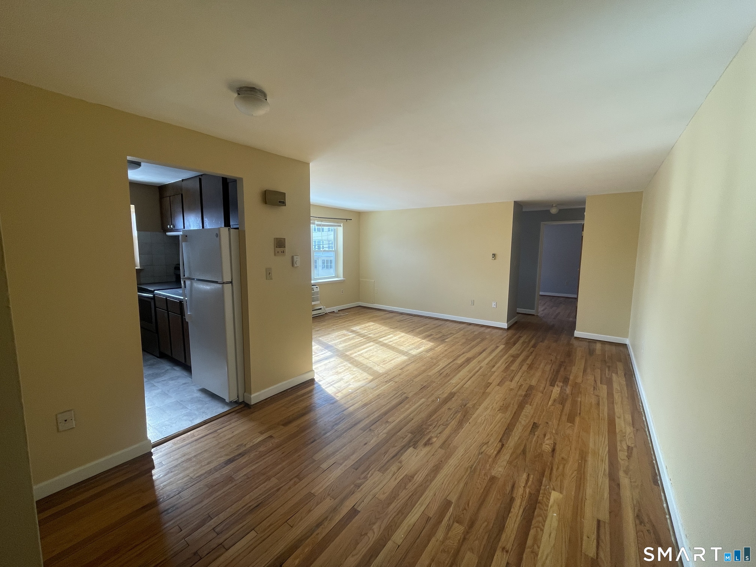 24 Merrill Street, Unit B3 Hartford, CT 06106 - Photo 2 of 9 a view of empty room with wooden floor