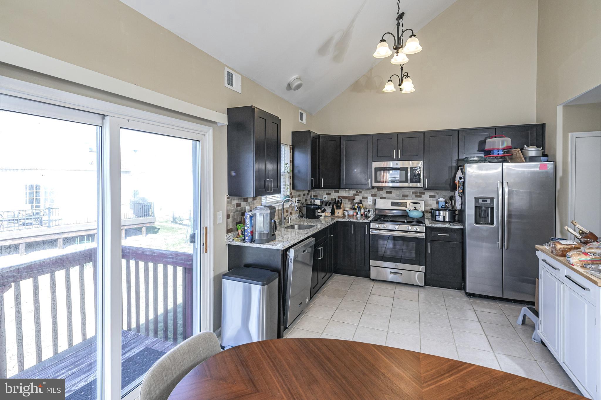 27 Richards Road Lawrence Township, NJ 08648 - Photo 13 of 43 Sliding Door leading to back stairs, Kitchen