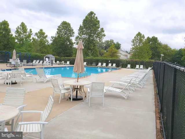 a view of a patio with a table and chairs