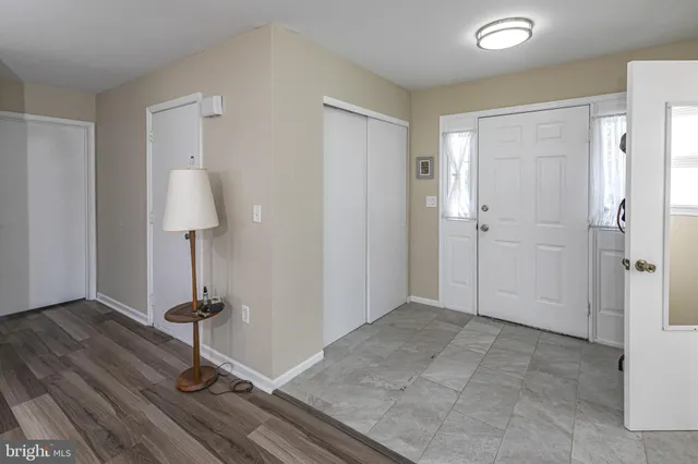 a view of a room with a mirror and gym equipment