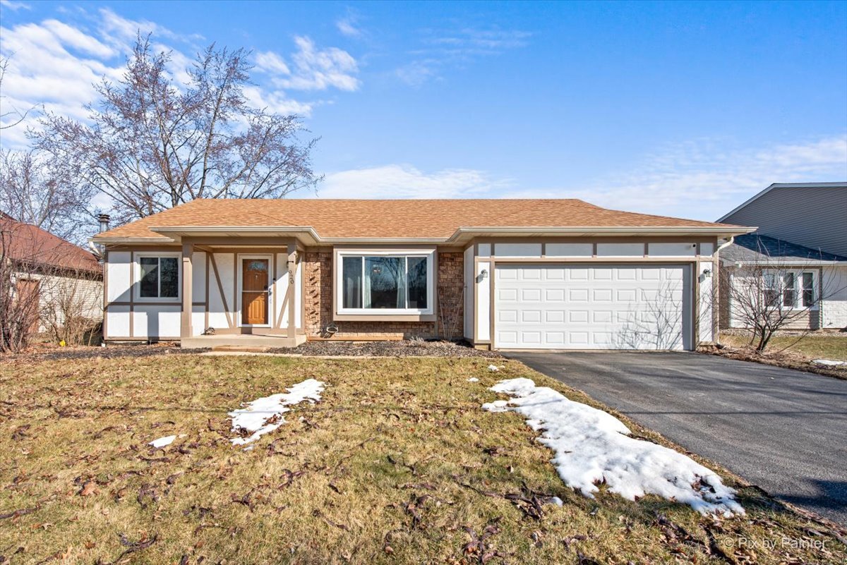 920 Mensching Road Roselle, IL 60172 - Photo 1 of 40 a front view of a house with a yard