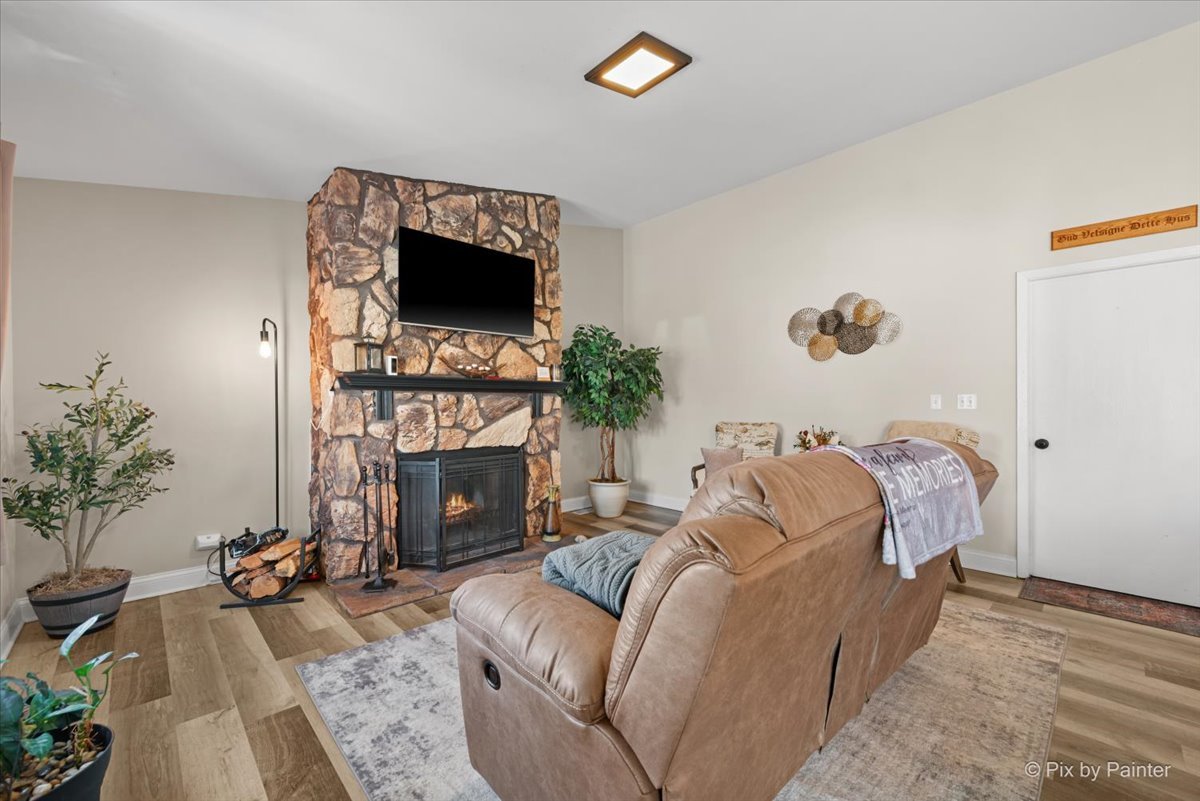 920 Mensching Road Roselle, IL 60172 - Photo 15 of 40 a bedroom with a bed and a fireplace