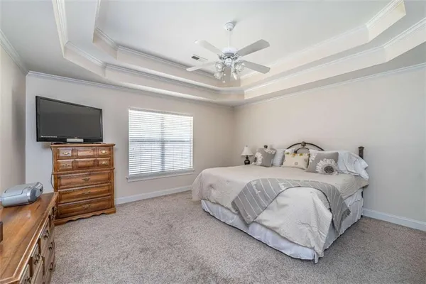 a bedroom with a bed and furniture