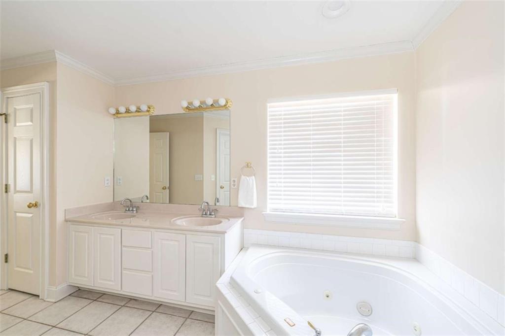 14 Limon Place Southwest Rome, GA 30165 - Photo 17 of 27 a bathroom with a tub sink and a window