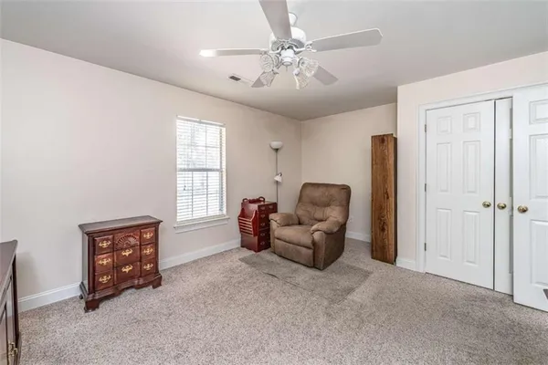 a living room with furniture and a window