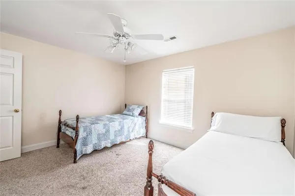 a bedroom with a bed and window