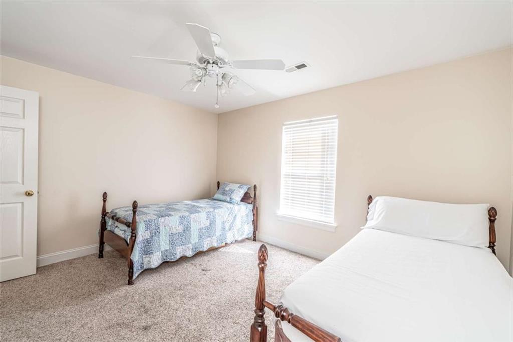 14 Limon Place Southwest Rome, GA 30165 - Photo 22 of 27 a bedroom with a bed and window