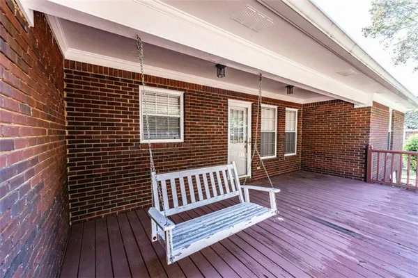 a view of a wooden deck with a bench