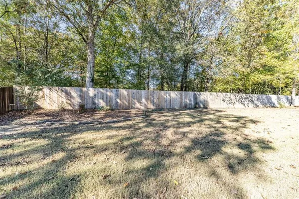 a view of a backyard of the house