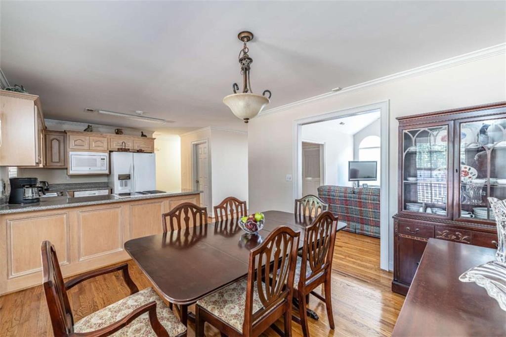 14 Limon Place Southwest Rome, GA 30165 - Photo 10 of 27 a view of a dining room with furniture large windows and wooden floor