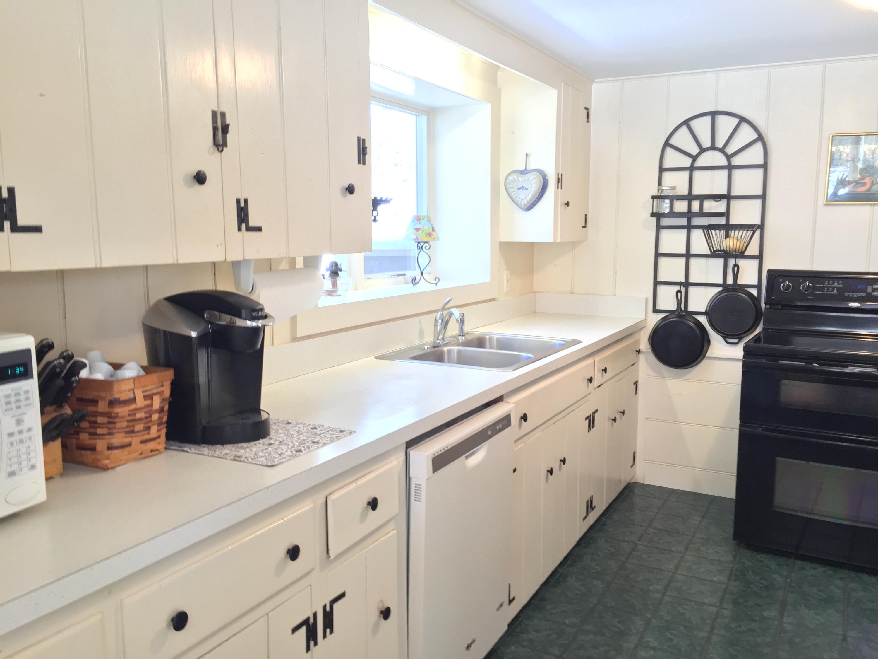 20 Depot Road Eastham, MA 02642 - Photo 5 of 13 a kitchen with granite countertop a sink and a stove