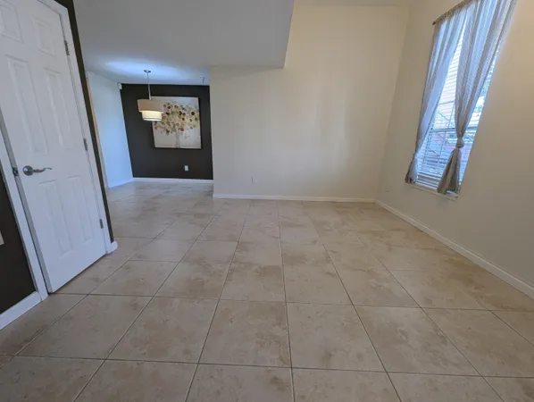 a view of an empty room and window