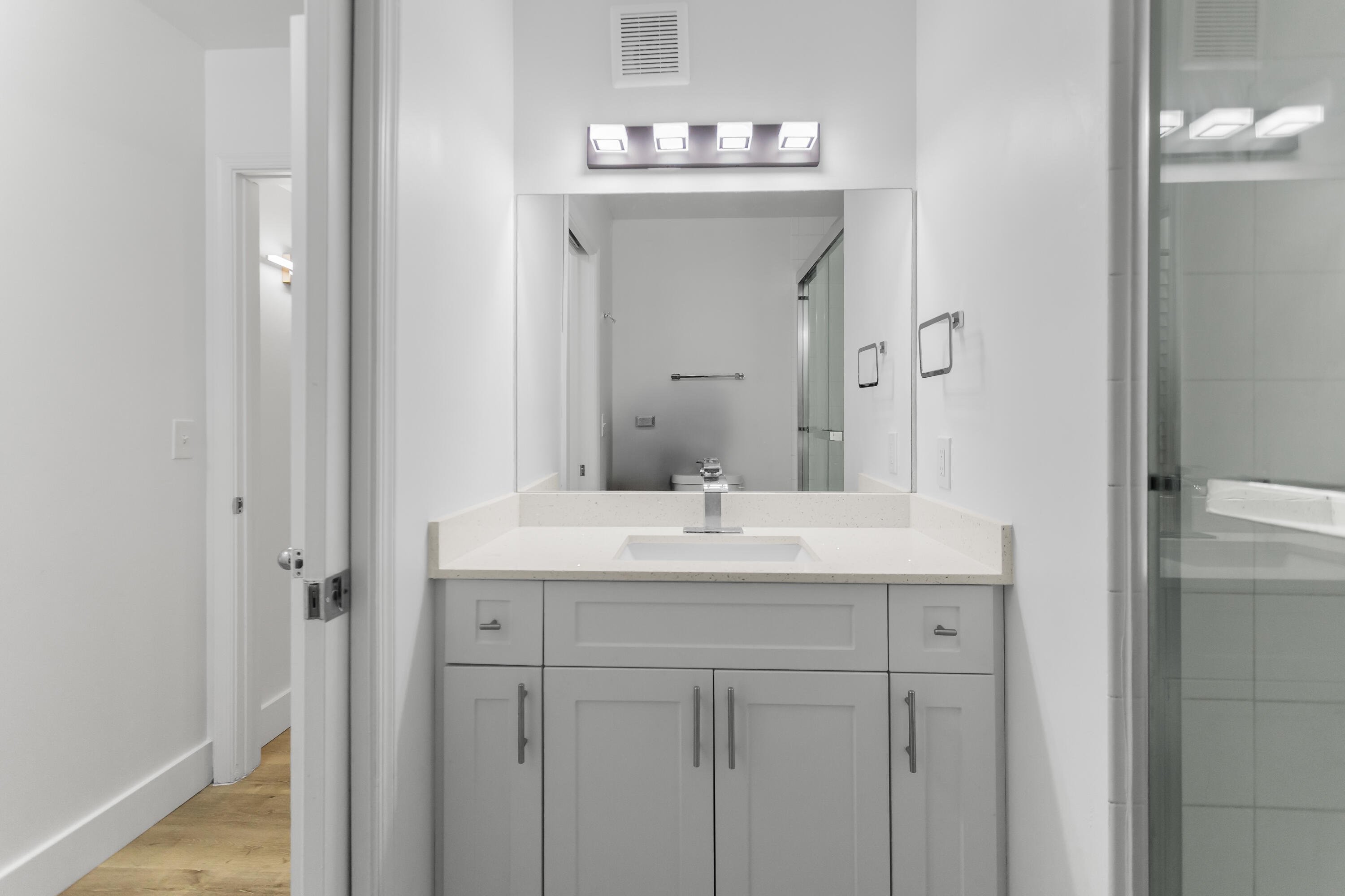 2113 Renaissance Boulevard, Unit 306 Miramar, FL 33025 - Photo 22 of 59 a bathroom with a sink and a mirror