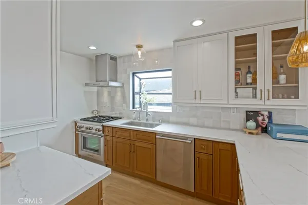 a spacious bathroom with double vanity and a mirror