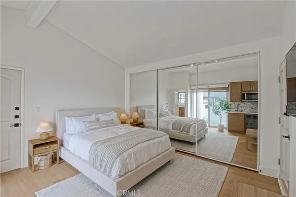 a bathroom with a granite countertop sink a vanity and a large mirror