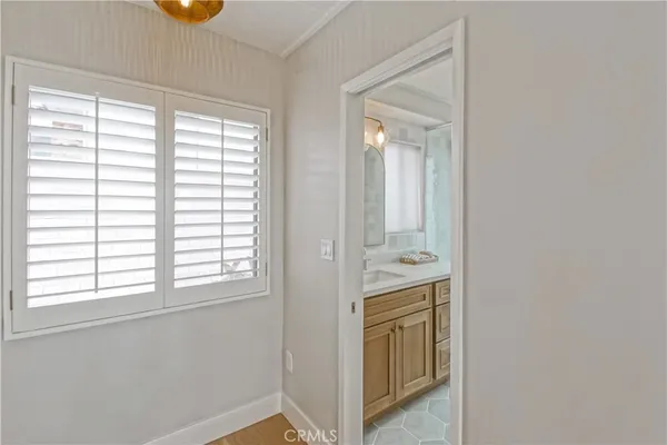 a bathroom with a sink a vanity and a mirror