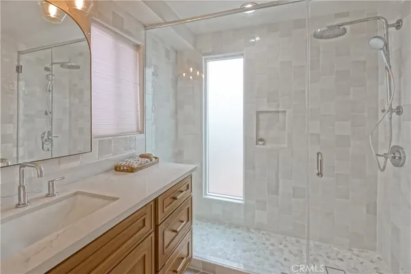 a bathroom with a shower and a sink