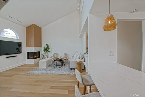 a living room with fireplace furniture and a flat screen tv