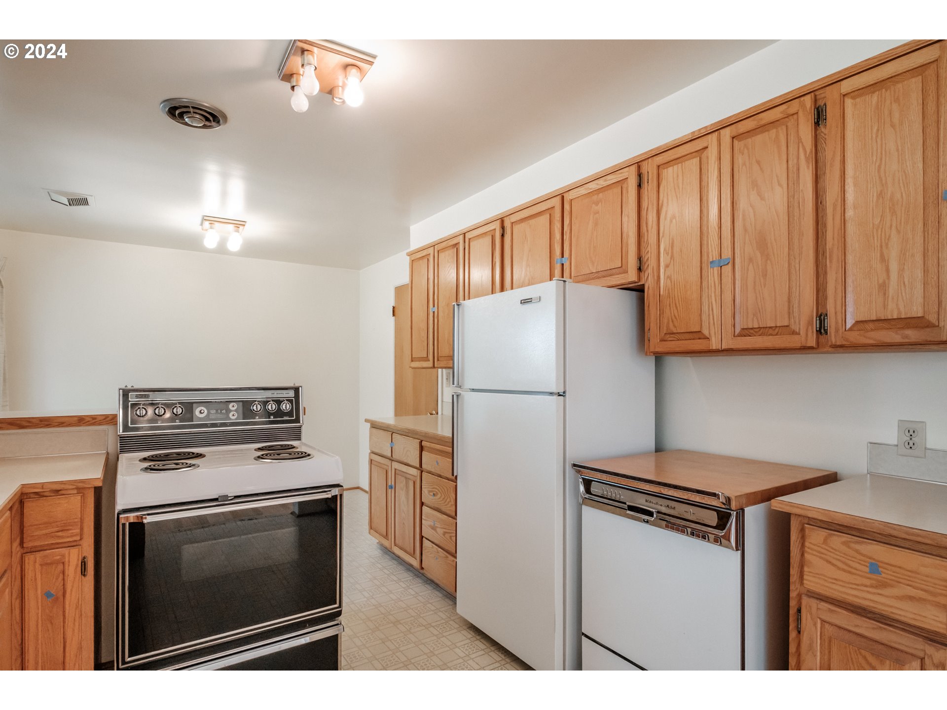 1620 Market Street Springfield, OR 97477 - Photo 15 of 31 a kitchen with a stove refrigerator and cabinets