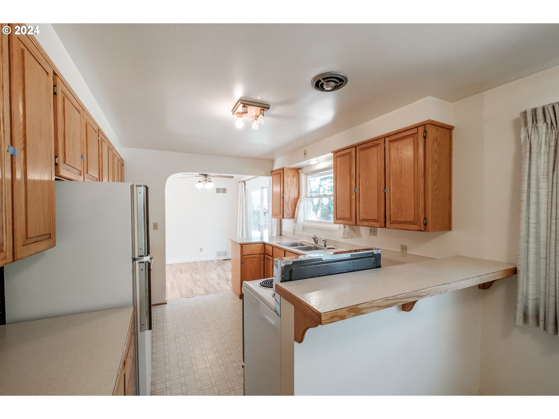 1620 Market Street Springfield, OR 97477 - Photo 17 of 31 a kitchen with kitchen island a sink appliances and a counter top space