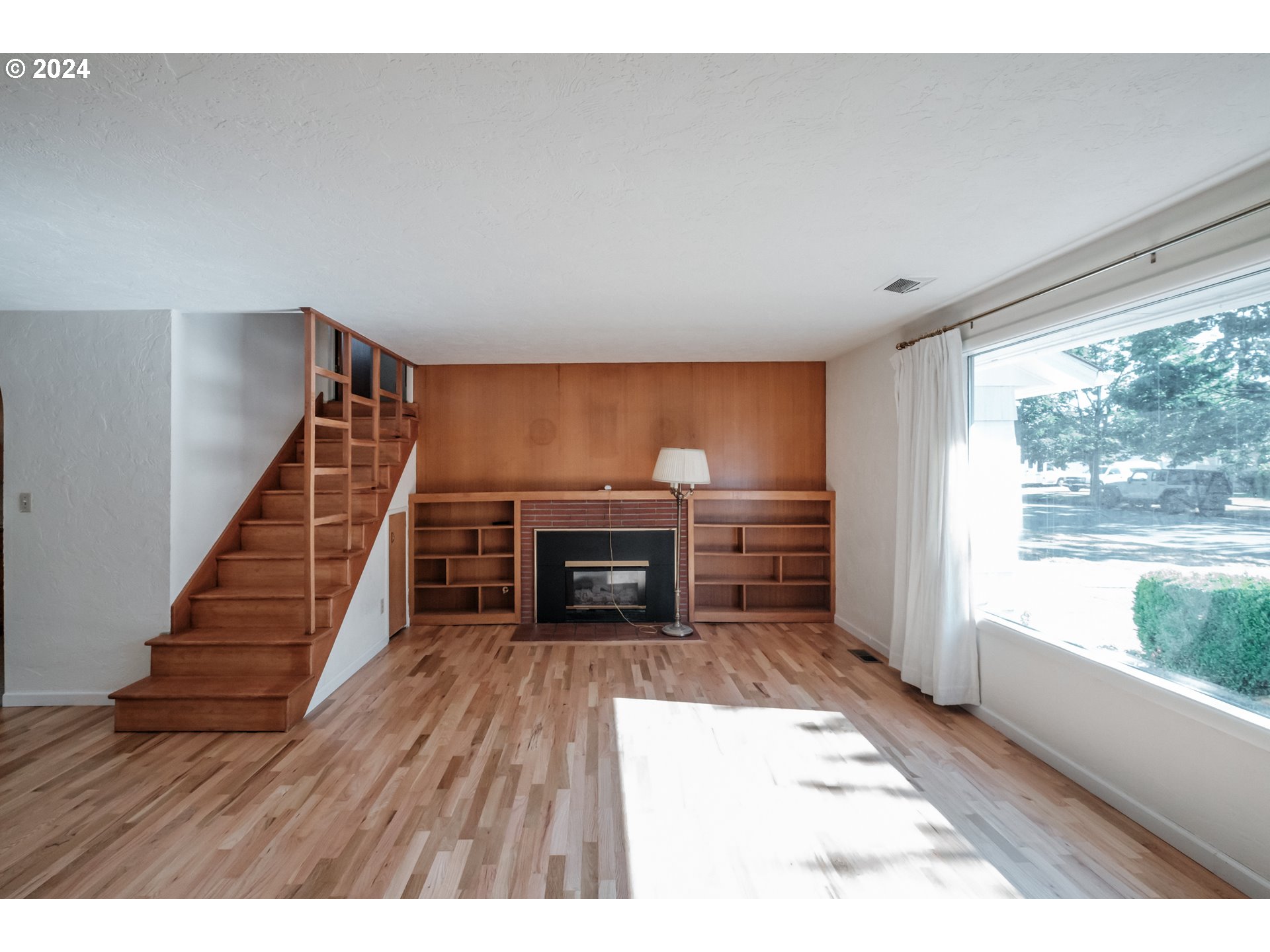 1620 Market Street Springfield, OR 97477 - Photo 6 of 31 a room with stairs and a wooden floor