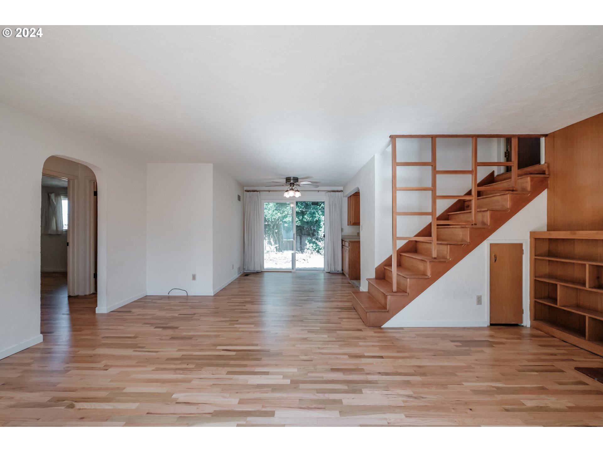 1620 Market Street Springfield, OR 97477 - Photo 10 of 31 a view of empty room with wooden floor and fan