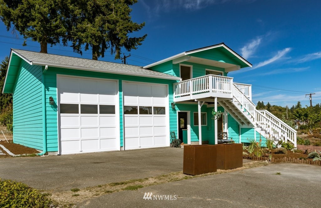 6623 Humphrey Road Clinton, WA 98236 - Photo 12 of 40 a view of a house with a yard