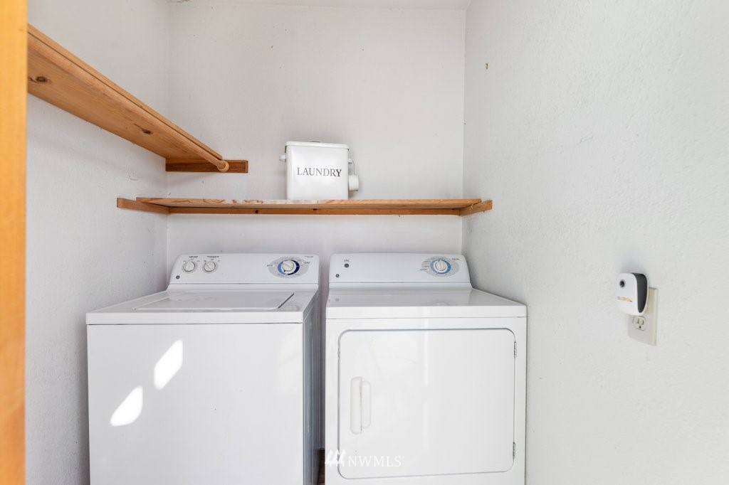 6623 Humphrey Road Clinton, WA 98236 - Photo 14 of 40 a utility room with dryer and washer