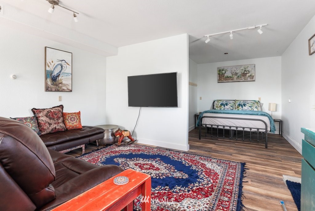 6623 Humphrey Road Clinton, WA 98236 - Photo 29 of 40 a living room with furniture and a flat screen tv