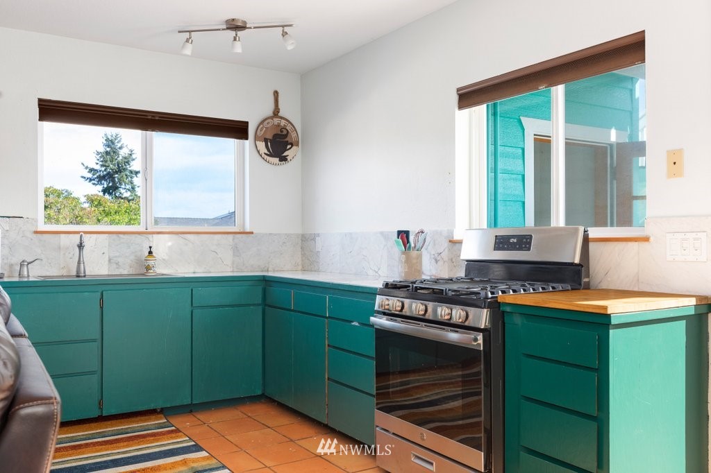 6623 Humphrey Road Clinton, WA 98236 - Photo 32 of 40 a kitchen with a sink and a window