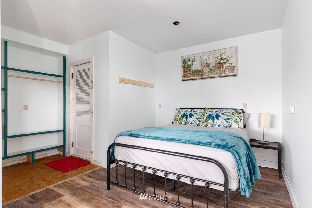 6623 Humphrey Road Clinton, WA 98236 - Photo 34 of 40 a bedroom with a bed and dresser