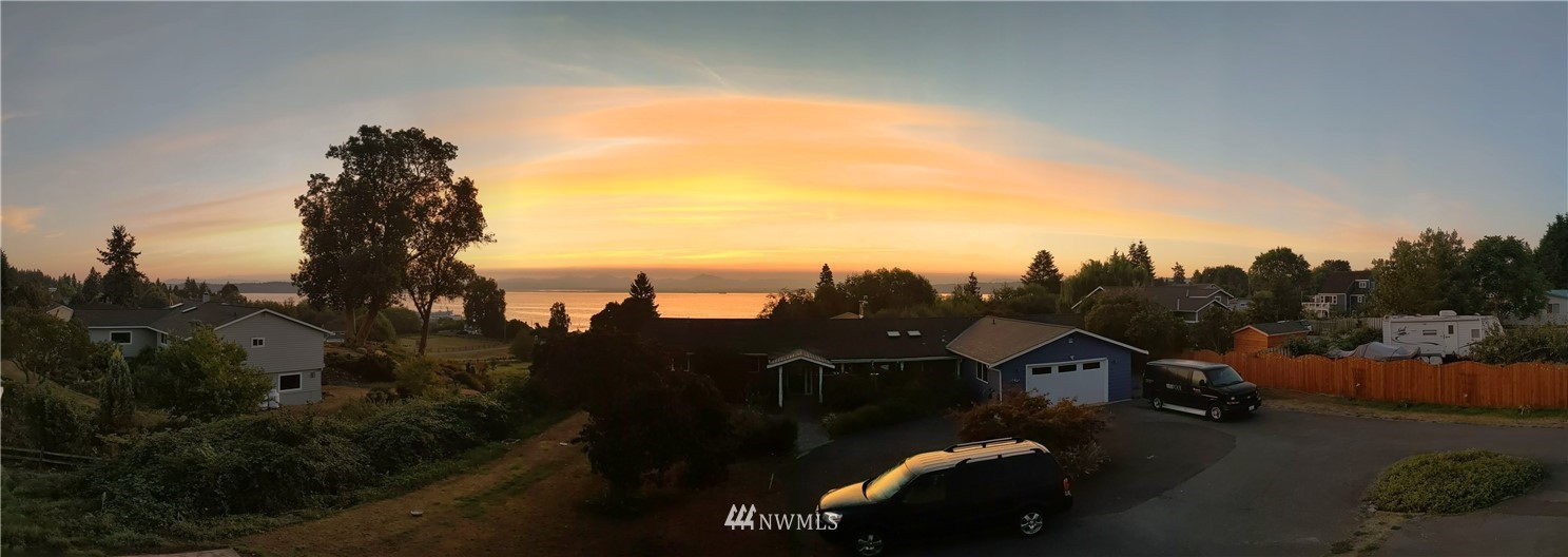 6623 Humphrey Road Clinton, WA 98236 - Photo 40 of 40 a view of a city street with a car parked on the roadside