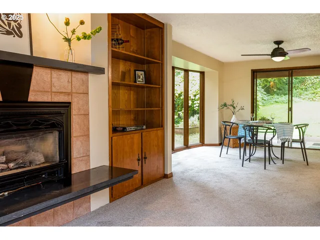 a dining room with furniture window and outside view